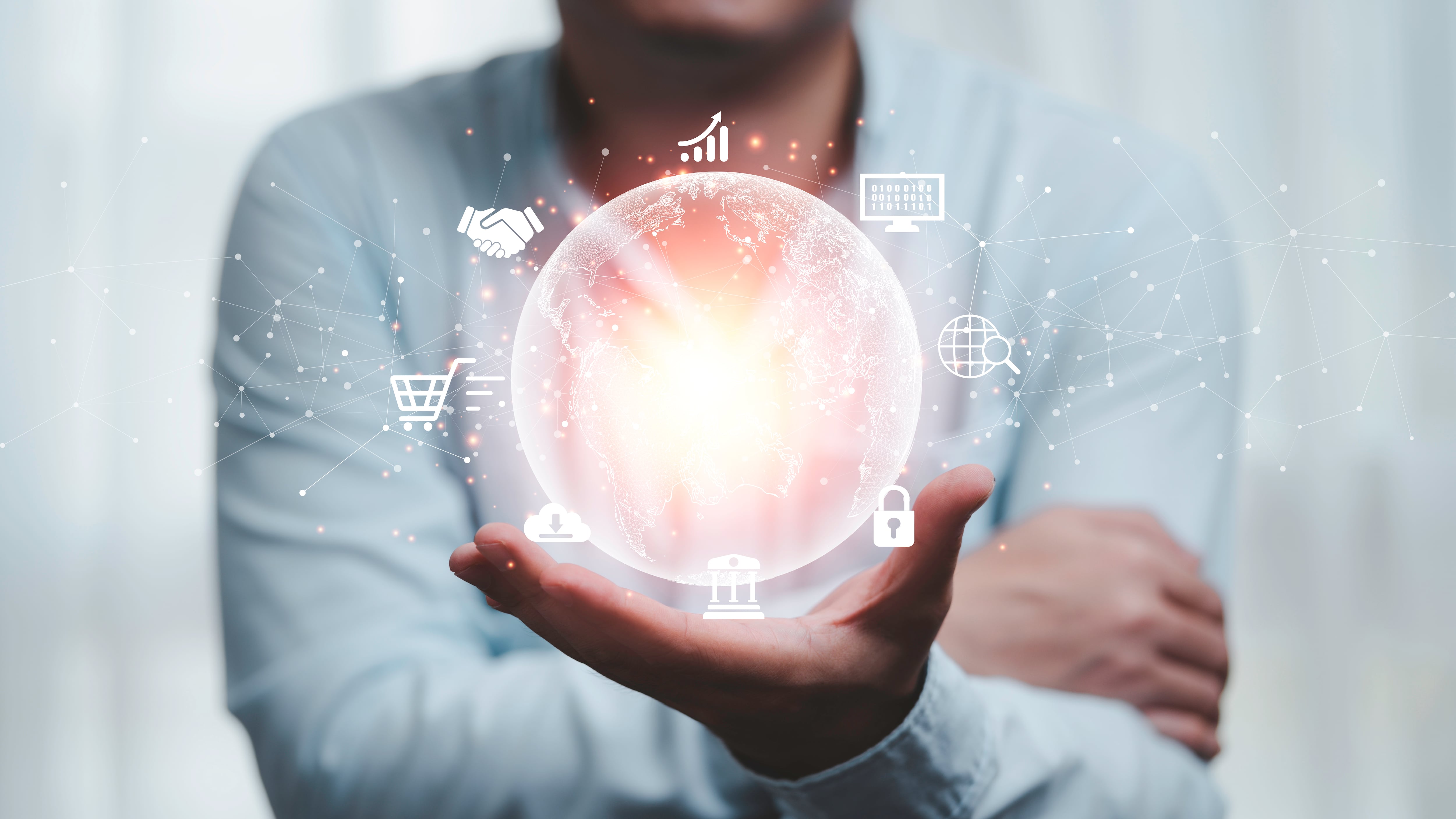 Una mano de hombre que sostiene el mundo virtual