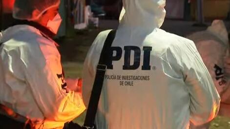 Imagen referencial de una pareja de detectives de la Policía de Investigaciones de Chile (PDI).