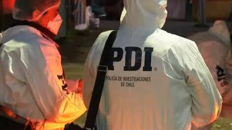 Imagen referencial de una pareja de detectives de la Policía de Investigaciones de Chile (PDI).