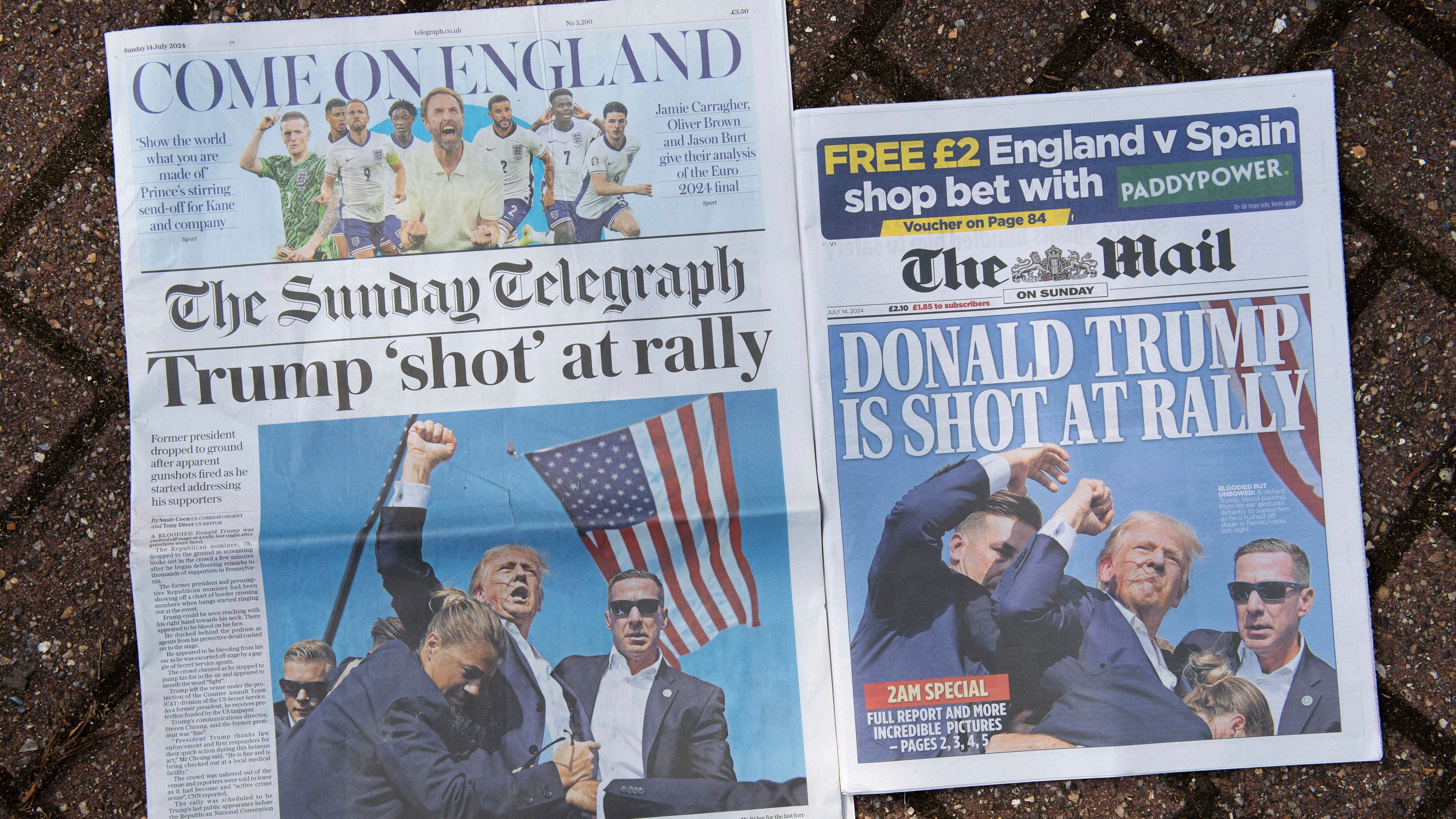 Dos portadas de periódicos nacionales británicos, últimas ediciones de Londres, el domingo 14 de julio de 2024, que muestran la reacción a los acontecimientos en el mitin de campaña del ex presidente Trump en Butler, Pensilvania. La campaña de Donald Trump dice que está "bien" después de lo que los funcionarios encargados de hacer cumplir la ley están tratando como un intento de asesinato durante un mitin en Butler, Pensilvania. (Foto AP/Thomas Krych)