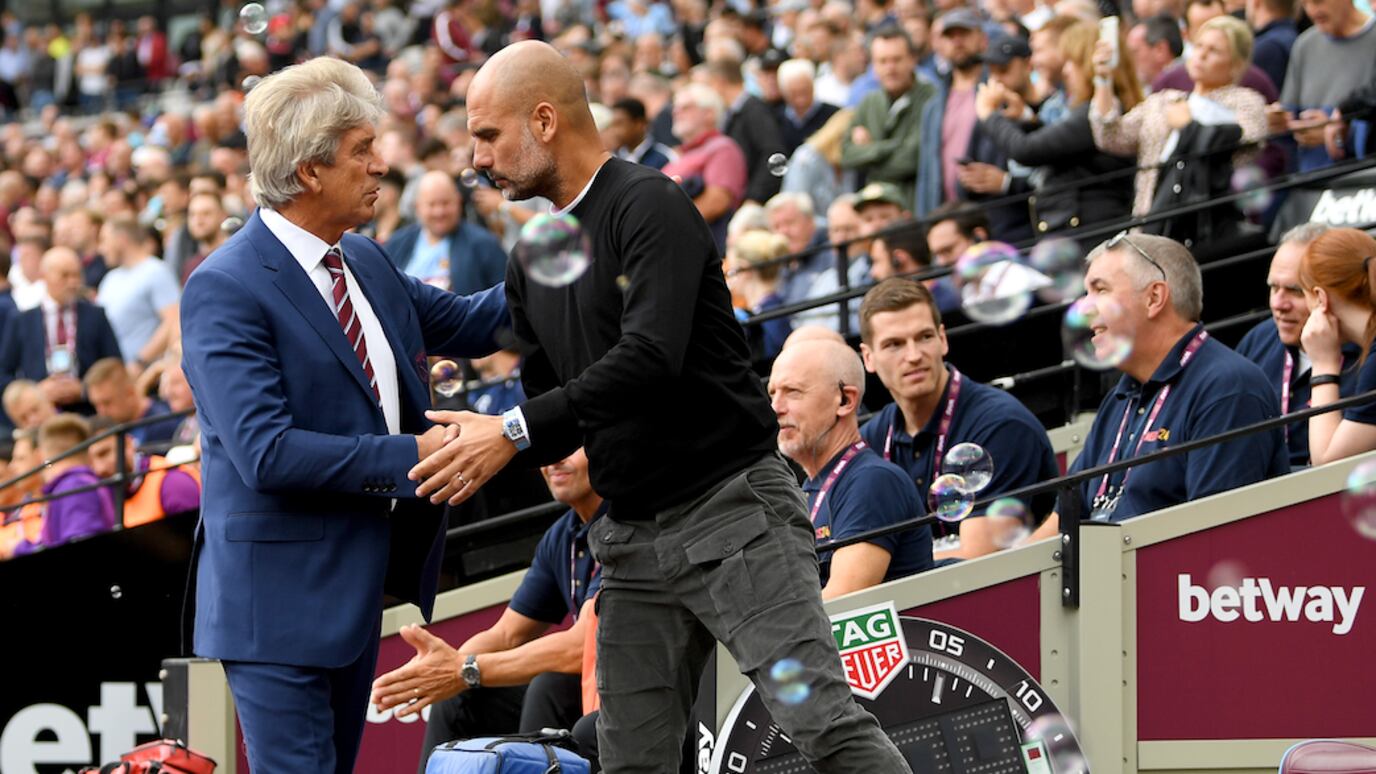 Manuel Pellegrini y Josep Guardiola / Getty